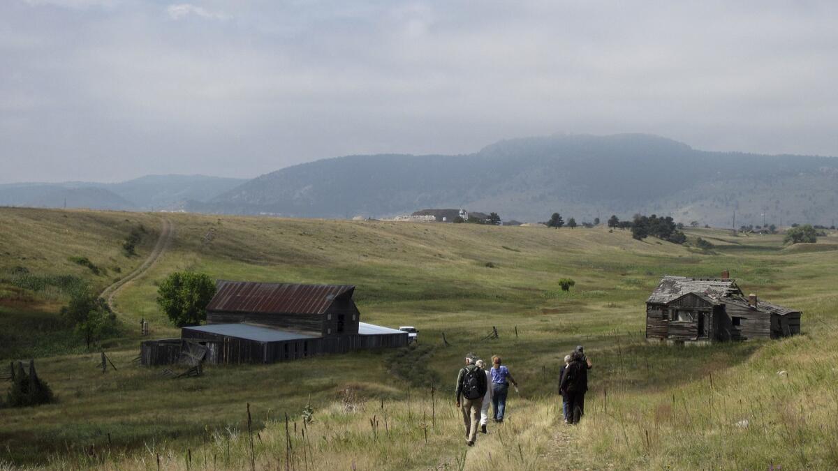 Visitors take a guided hike through the Rocky Flats National Wildlife Refuge near Denver last year.