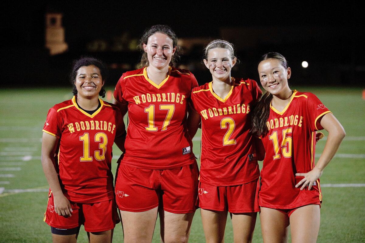 Four Woodbridge High flag football players.