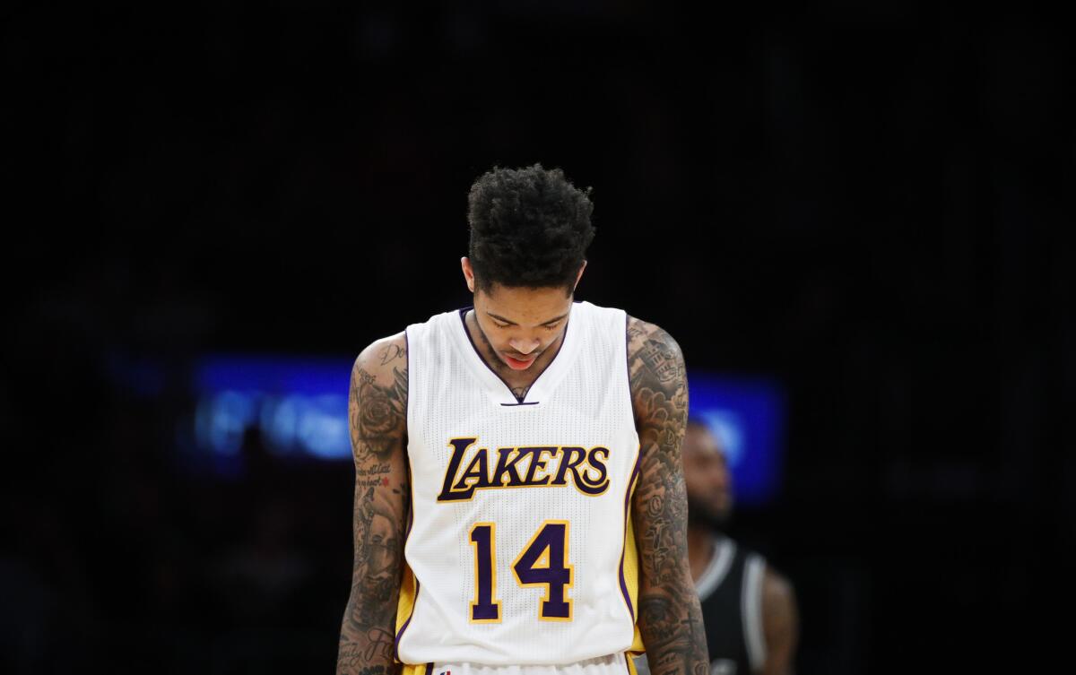 Los Angeles Lakers' Brandon Ingram drops his head as he walks across the field during the second half of an NBA basketball game against the San Antonio Spurs, Sunday, Feb. 26, 2017, in Los Angeles. The Spurs won 119-98. (AP Photo/Jae C. Hong)