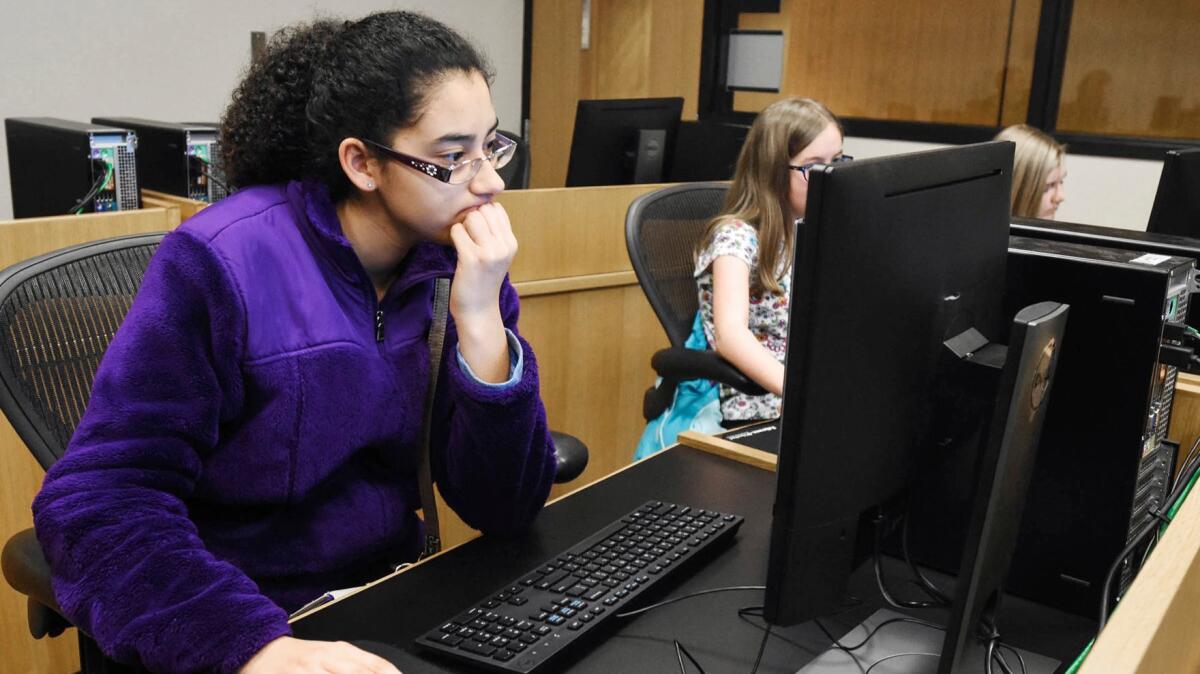 Serena Perez-Takaya works on making a phone app simulation at the Allen County Public Library in Fort Wayne, Ind. on Feb. 15.