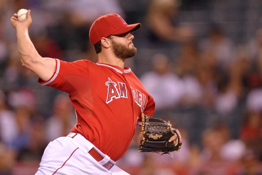Angels right-hander Cam Bedrosian pitches during the game against the Astros on Sept. 12, 2014 at Angel Stadium.