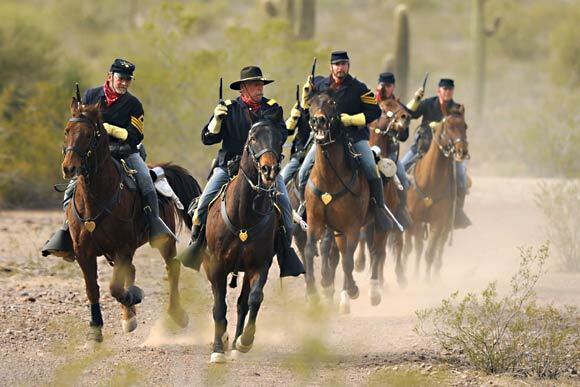 Union soldiers attack Confederate cavalrymen during an reenactment of the Battle of Picacho Pass.