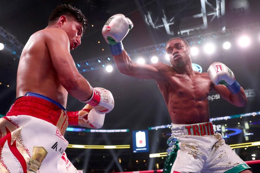 ARLINGTON, TEXAS - MARCH 16: (R-L) Errol Spence Jr fights Mikey Garcia in an IBF World Welterweight Championship bout at AT&T Stadium on March 16, 2019 in Arlington, Texas. (Photo by Tom Pennington/Getty Images) ** OUTS - ELSENT, FPG, CM - OUTS * NM, PH, VA if sourced by CT, LA or MoD **