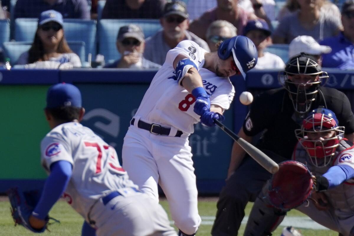 Zach McKinstry hits a grand slam off Chicago Cubs starting pitcher Adbert Alzolay during the second inning Sunday.