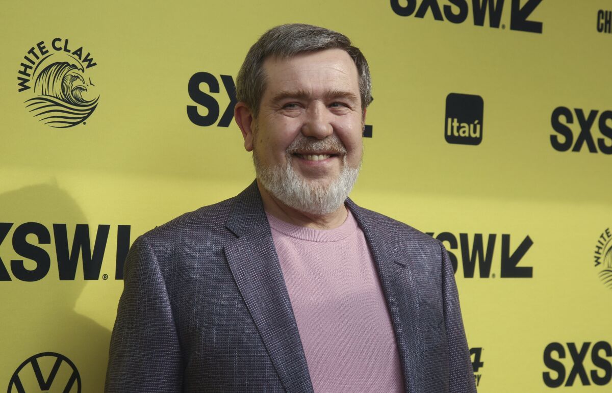 Alexey Pajitnov at the "Tetris" premiere in front of the SXSW backdrop