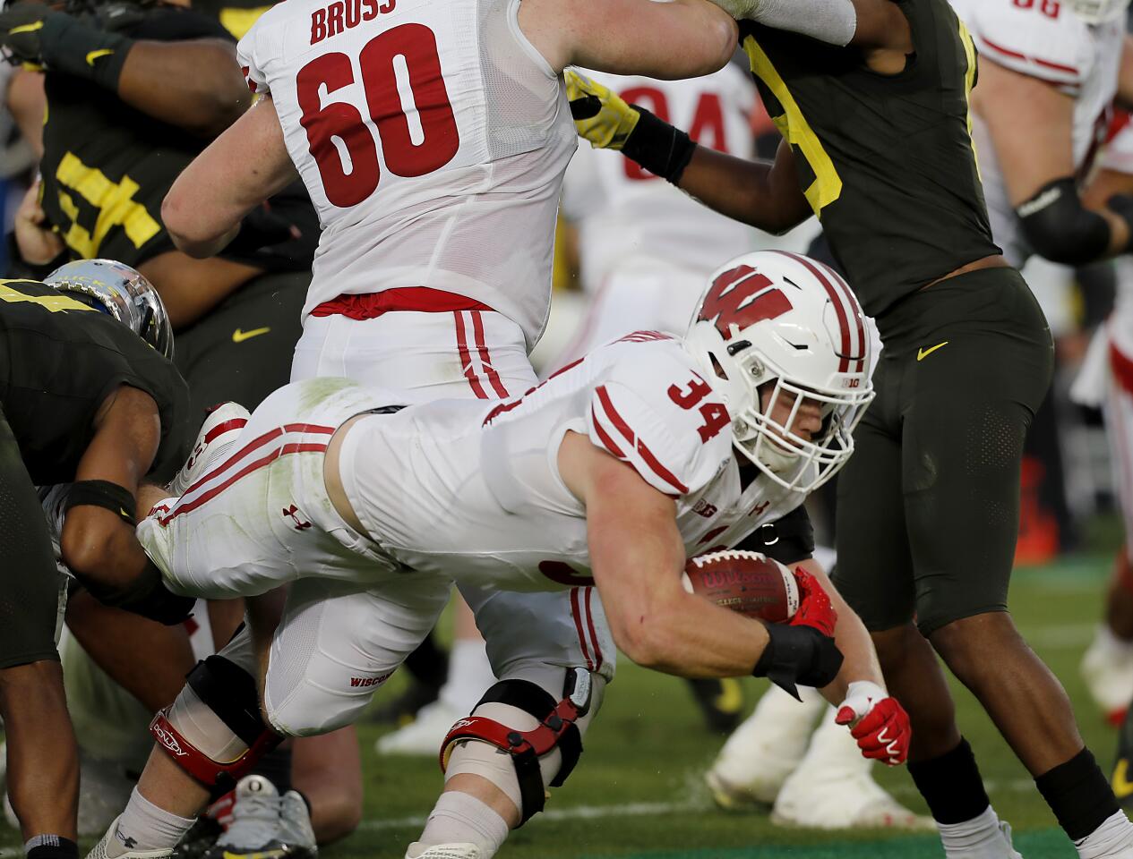 Wisconsin running back Mason Stokke dives into the end zone against Oregon during the third quarter.