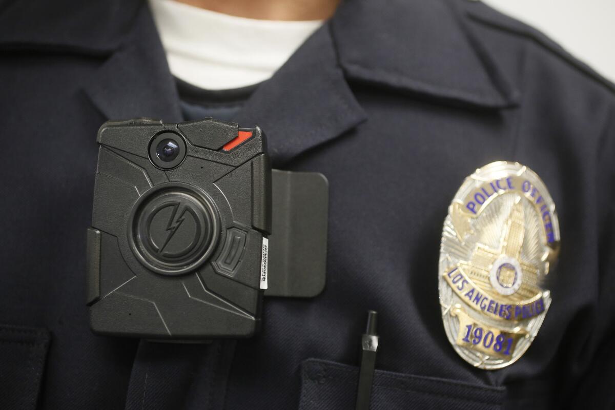 An LAPD officer wears an on-body camera during a demonstration in January of 2014.