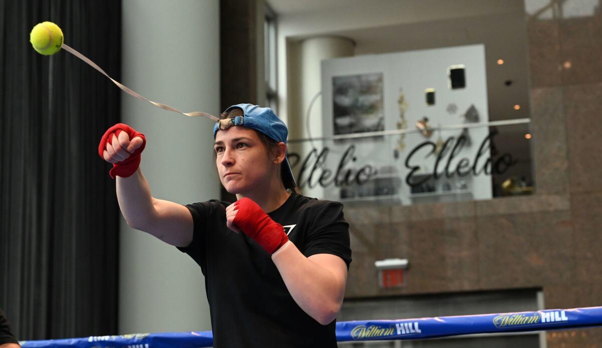 Katie Taylor hits a tennis ball during a workout in New York on Wednesday as she prepares for her fight against Delfine Persoon at Madison Square Garden on Saturday.