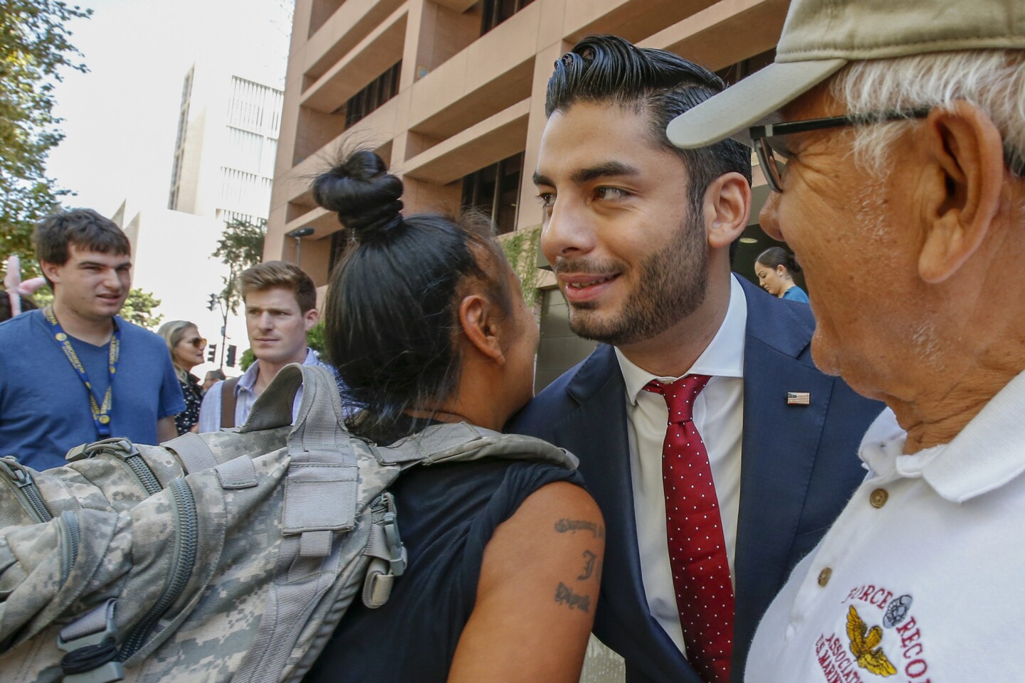 Ammar Campa-Najjar, meets and greets protestors rallying against Duncan Hunter at a federal courthouse in San Diego.