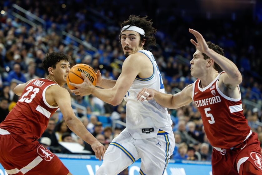 LOS ANGELES, CA - FEBRUARY 16: UCLA Bruins guard Jaime Jaquez Jr. (24) drives against a Cardinal defender as UCLA plays Stanford at Pauley Pavilion on Thursday, Feb. 16, 2023 in Los Angeles, CA. (Jason Armond / Los Angeles Times)