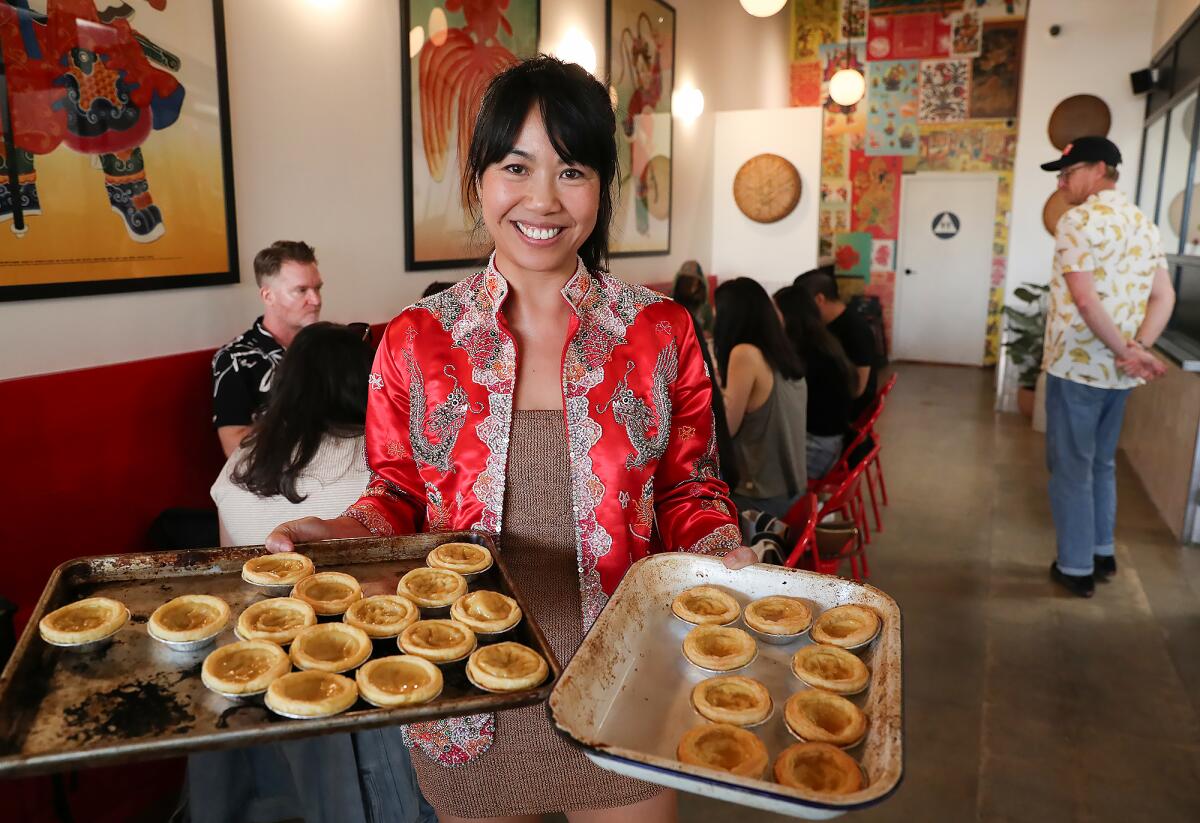 Co-founder and chef Jo Situ-Allen with desert tarts at the Mo Mi Mei restaurant in Costa Mesa.