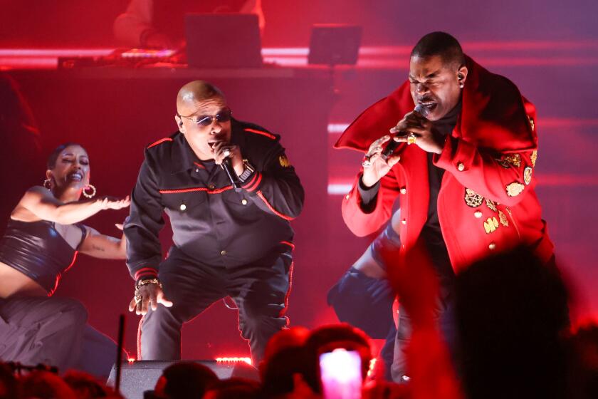 Spliff Star, left, and Busta Rhymes perform onstage during the 65th Grammy Awards.