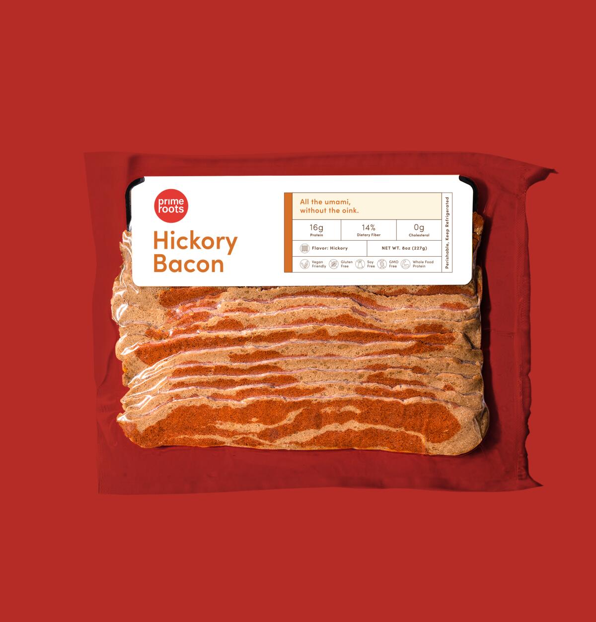 A package of plant-based hickory bacon. 