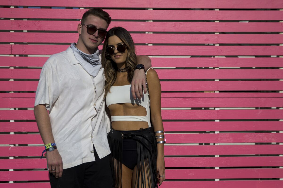 Jeremy Brugo, 21, of Greenwich, Conn., and Amber Harrelson, 20, of San Diego, show off the classic look of Coachella.