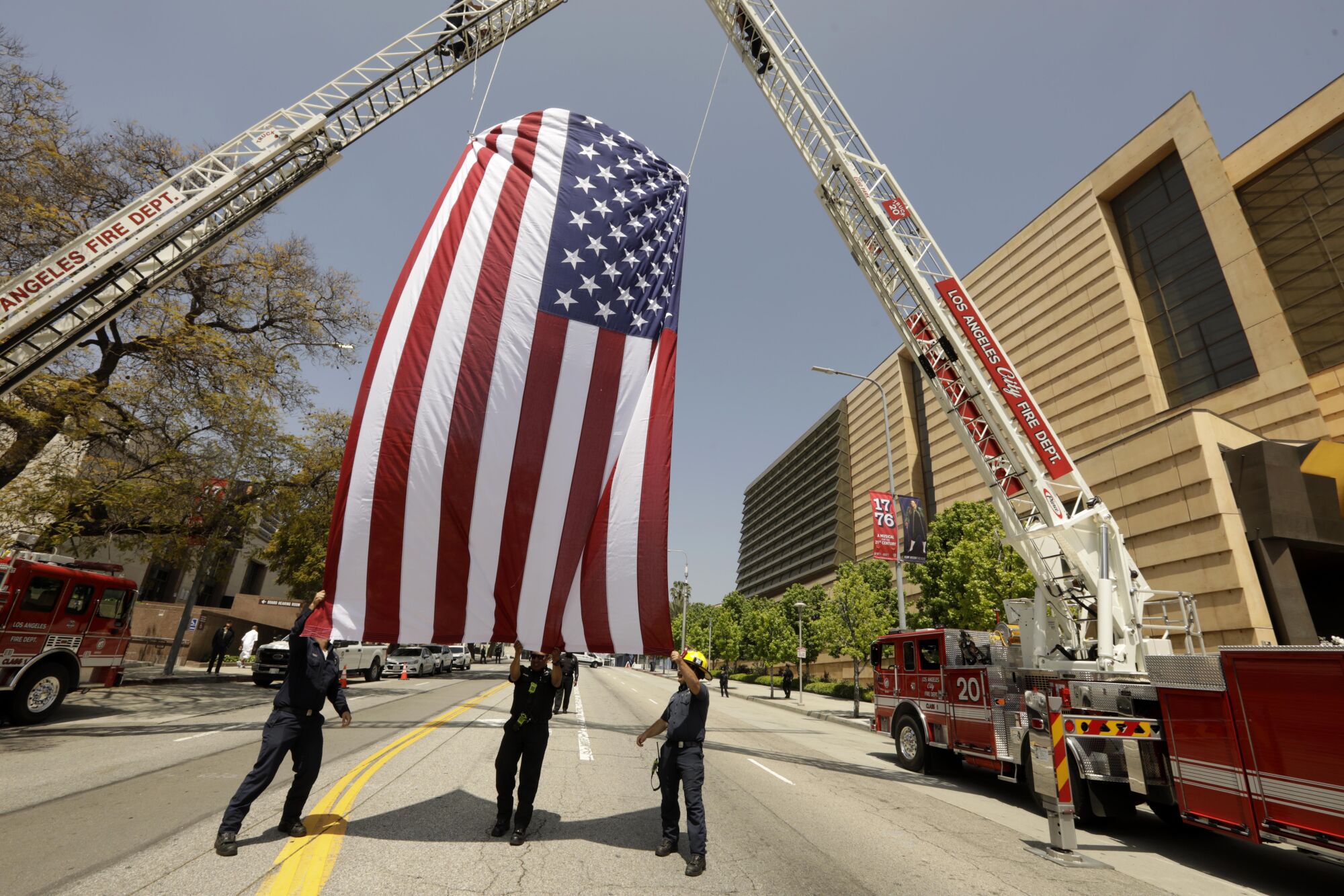 LAFD flies the US flag during a mass celebration commemorating the life of former Los Angeles Mayor Richard Riordan 