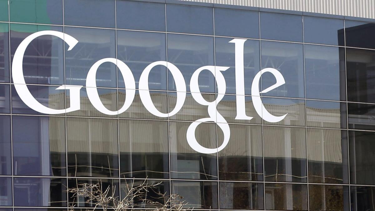 This Jan. 3, 2013, file photo shows a Google sign at the company's headquarters in Mountain View, Calif.