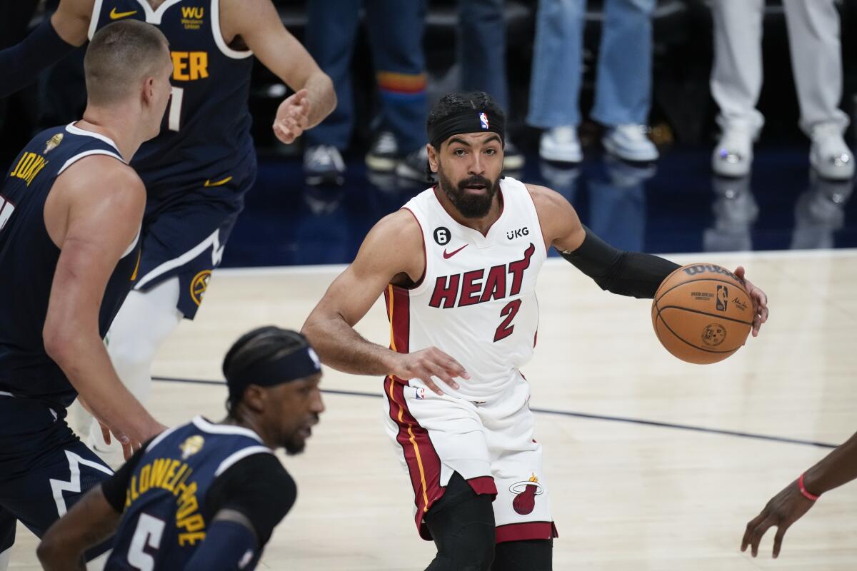 Heat guard Gabe Vincent drives across the lane against the Nuggets in Game 2 of the NBA Finals.