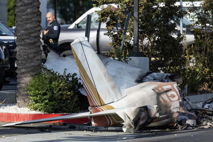 HAWTHORNE, CA - SEPTEMBER 06: Two people were critically injured in a single-engine plane crash on W 126th Street near Hawthorne Boulevard in Hawthorne, CA on Friday, Sept. 6, 2024. The crash occured around 12:40 a.m. near Hawthorne City Hall. (Myung J. Chun / Los Angeles Times)