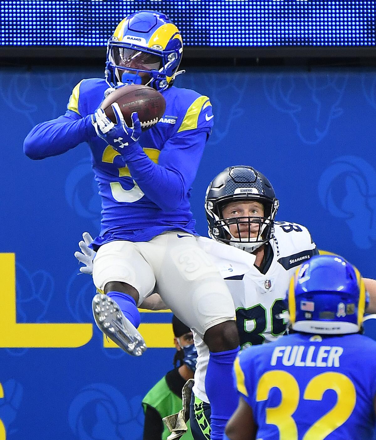 Rams cornerback Darious Williams intercepts a pass in the end zone against Seattle.