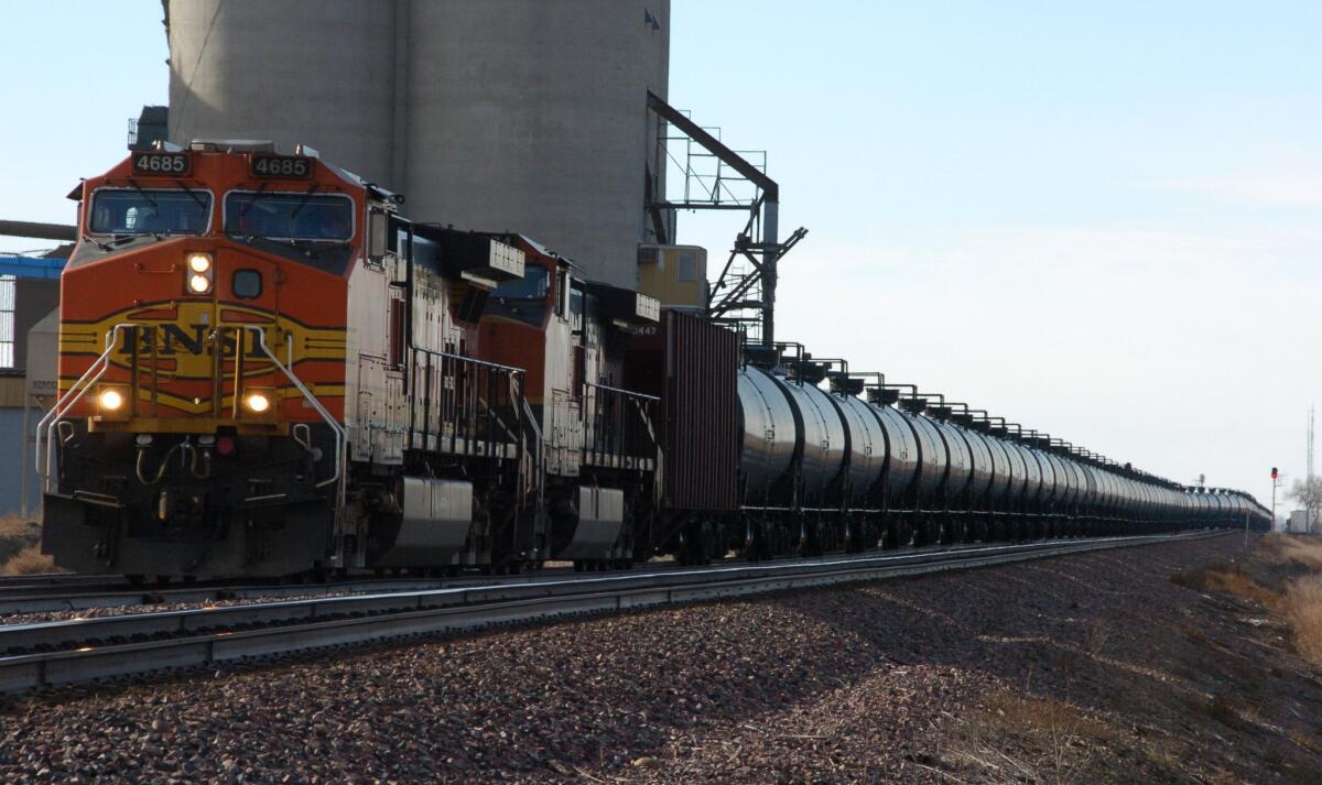 A BNSF Railway train hauls crude oil west of Wolf Point, Mont. The rail company has agreed to pay $140,000 in penalties, medical expenses and emergency response costs stemming from a 2012 spill of hazardous chemicals near the Port of Los Angeles, the city attorney announced this week.