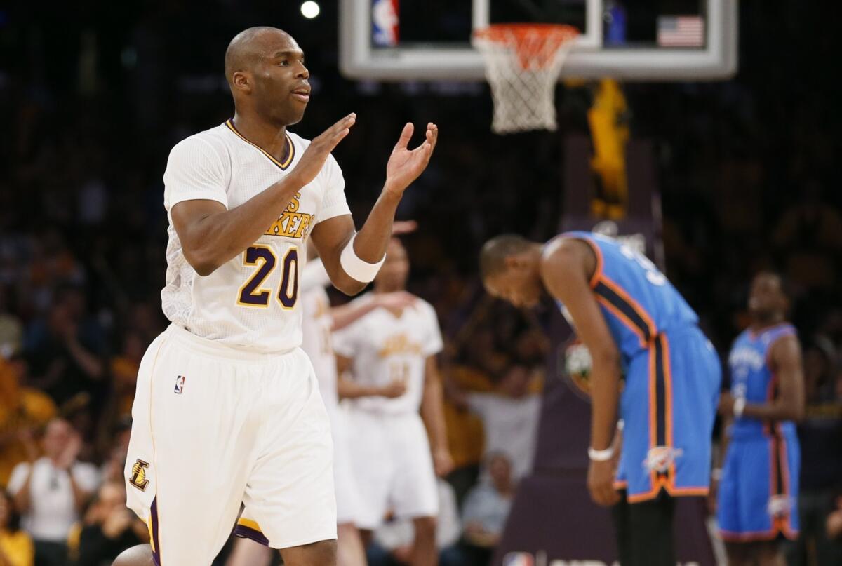 Lakers guard Jodie Meeks celebrates late in the fourth quarter of the team's 114-110 win Sunday over the Oklahoma City Thunder at Staples Center.