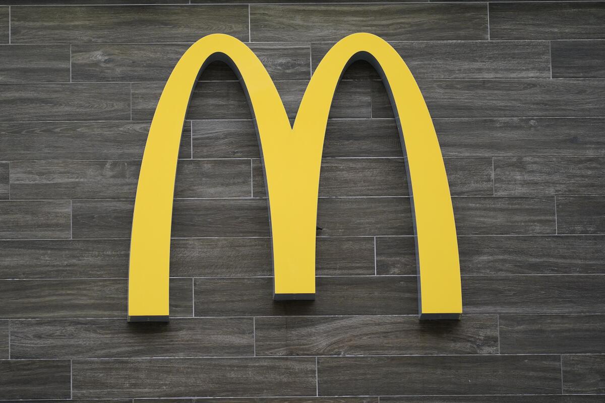 A McDonald's golden arches logo on a wall