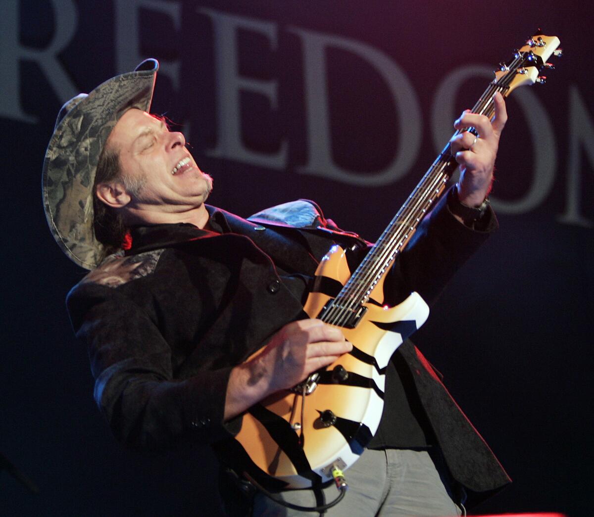 Ted Nugent performs during the opening ceremony of the National Rifle Assn.'s annual convention in 2006. The rocker has been invited to appear with Texas Republican gubernatorial candidate Greg Abbott, the state's attorney general.