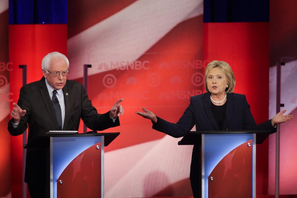 Democratic presidential candidates Sen. Bernie Sanders and former Secretary of State Hillary Clinton spar during a Feb. 4 debate in Durham, N.H.