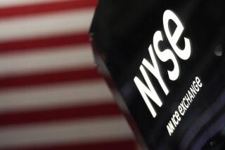 An NYSE sign is seen on the floor at the New York Stock Exchange in New York, Wednesday, Feb. 22, 2023. (AP Photo/Seth Wenig)
