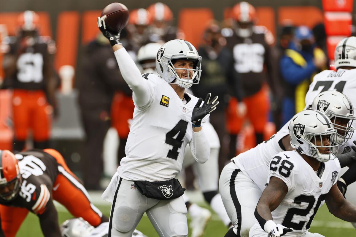 Las Vegas Raiders quarterback Derek Carr throws during the first quarter of an NFL football game.