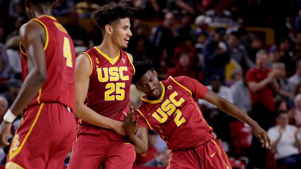USC guard Jonah Mathews (2) and forward Bennie Boatwright (25) celebrate a basket against Arizona State during the second half Sunday.