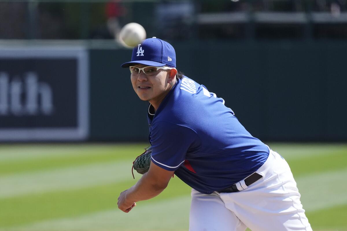 Los Angeles Dodgers starting pitcher Julio Urias warms up during the second inning.