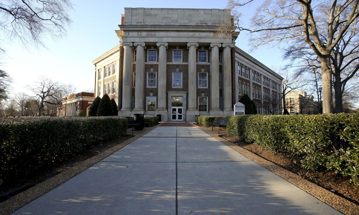 Bibb Graves Hall, seen on the campus of the University of Alabama in Tuscaloosa, Ala., on Thursday, Feb. 10, 2022. The University of Alabama is reconsidering its decision last week to retain the name of a one-time governor who led the Ku Klux Klan on a campus building while adding the name of the school's first Black student. Trustees will meet publicly in a livestreamed video conference on Friday, Feb. 11, 202, to revisit their decision to keep the name of former Alabama Gov. Bibb Graves on a three-story hall while renaming it Lucy-Graves Hall to also honor Autherine Lucy Foster, the University of Alabama System said. (Gary Cosby Jr./The Tuscaloosa News via AP)