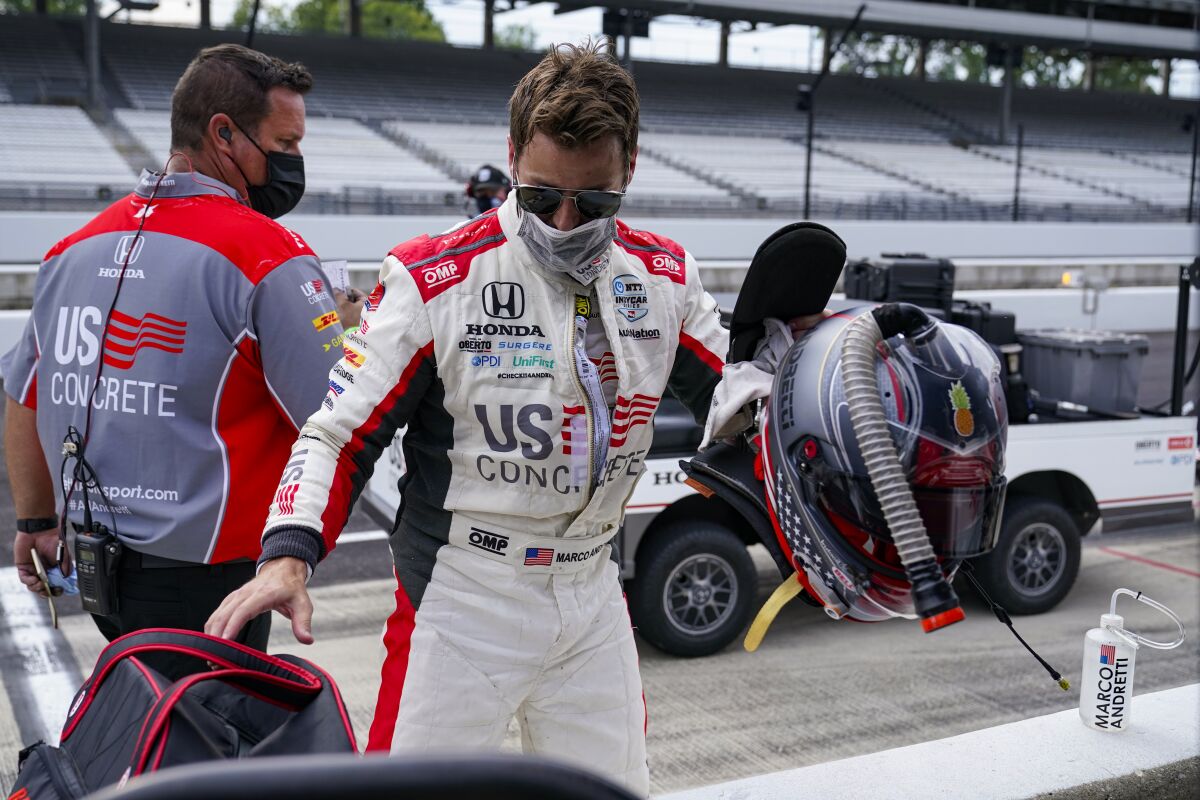 Marco Andretti packs up his gear following practice for the Indianapolis 500 auto race at Indianapolis Motor Speedway in Indianapolis, Thursday, Aug. 13, 2020. (AP Photo/Michael Conroy)