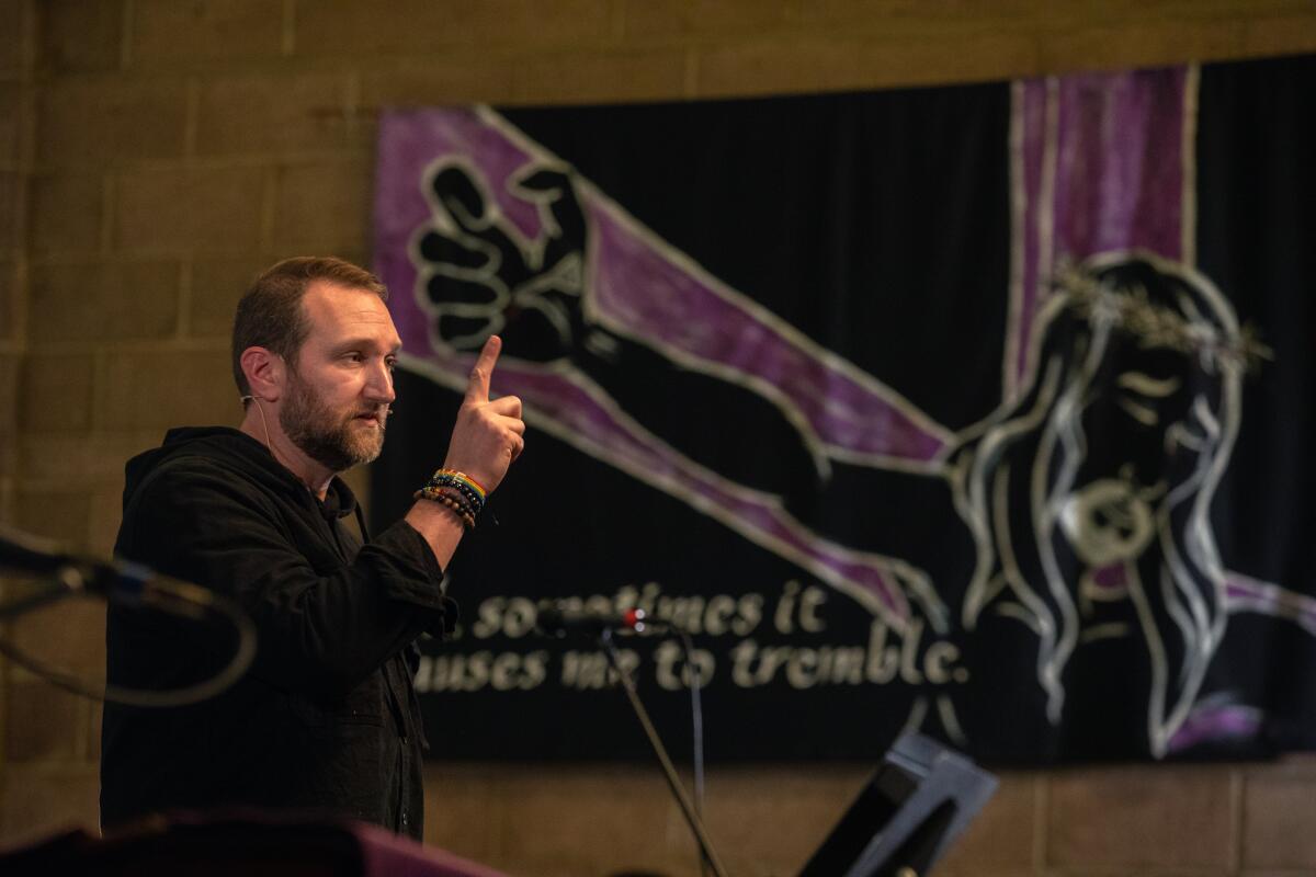 Pastor Ryan Chaddick speaks during a vigil at American Lutheran Church in Burbank.