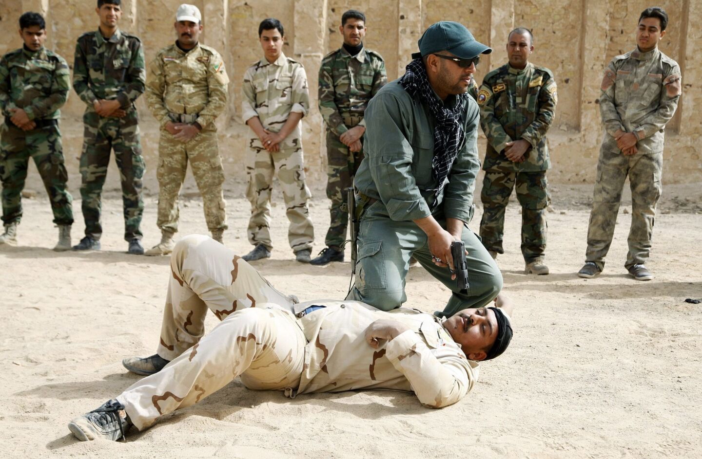 Shiite volunteers receive martial arts training at a military base in Najaf, southern Iraq. Shiite volunteers have been assisting the Iraqi army as it battles fighters from the group calling itself the Islamic State.