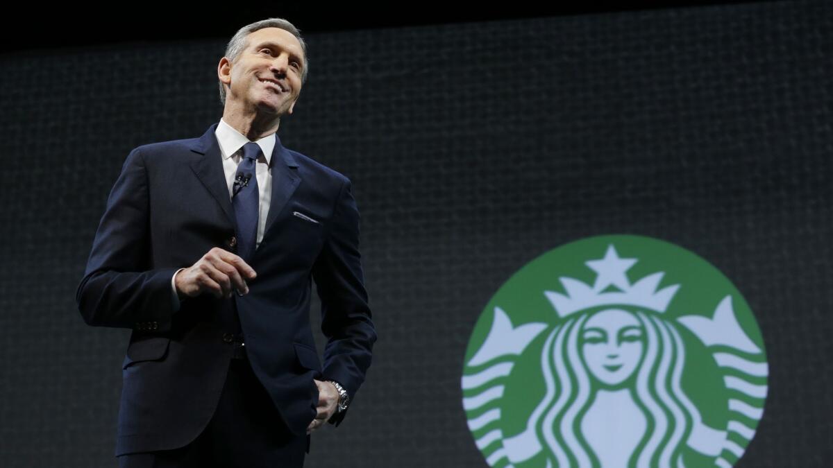 Former Starbucks CEO Howard Schultz speaks at the coffee company's annual shareholders meeting in Seattle in 2015.