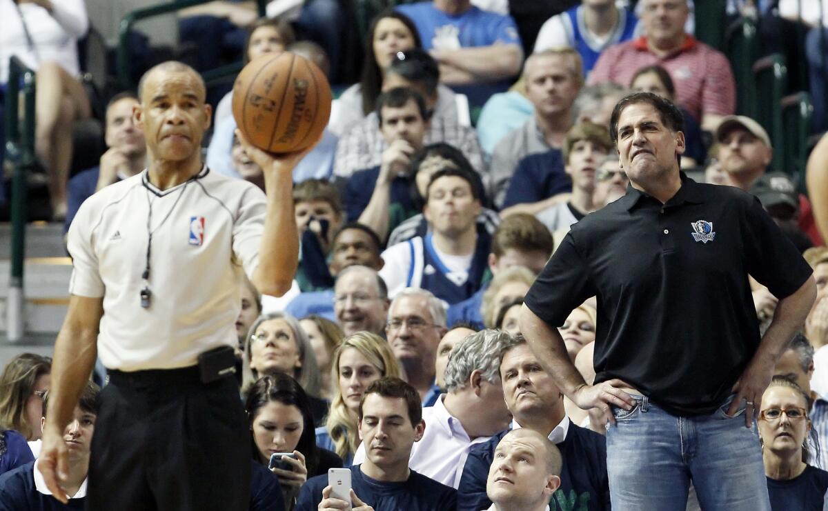 Dallas Mavericks owner Mark Cuban takes issue with a call during a March 23 game against the San Antonion Spurs in Dallas.