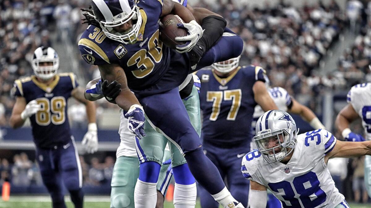 ARLINGTON, TEXAS, SUNDAY, OCTOBER 1, 2017 - Rams running back Todd Gurley leaps over Cowboys defenders during a third quarter drive at ATT&T Stadium. (Robert Gauthier/Los Angeles Times)