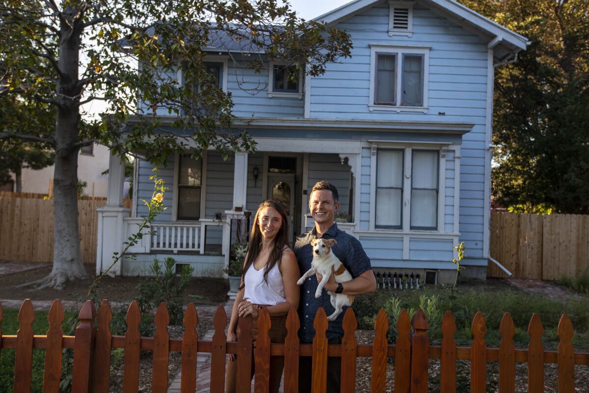 Duane Rohrbacher, wife Shannon Quihuiz, and their dog, Max, are French Park homeowners