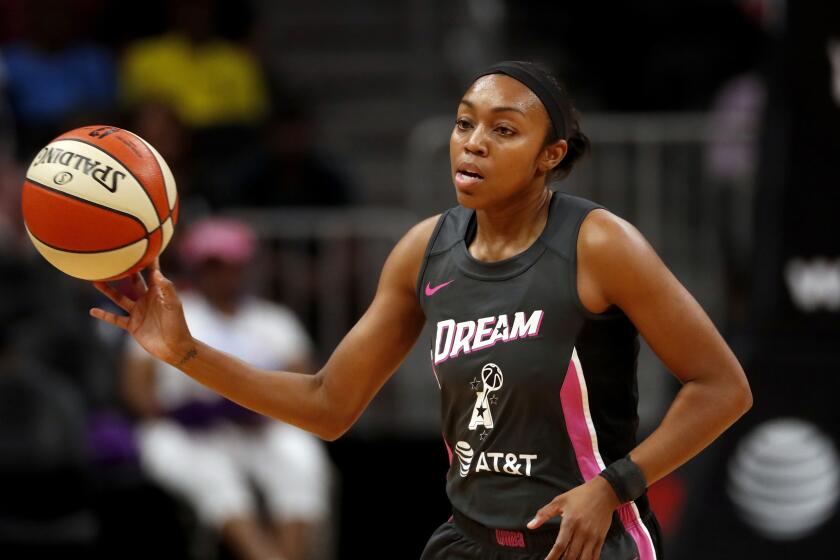 FILE - Atlanta Dream guard Renee Montgomery (21) passes the ball in the first half of a WNBA basketball game against the Chicago Sky in Atlanta, in this Tuesday, Aug. 20, 2019, file photo. Larry Gottesdiener has been approved as the head of a new three-member ownership group of the WNBA's Atlanta Dream following pressure on former Sen. Kelly Loeffler to sell her share of the team. Friday's, Feb. 26, 2021, unanimous approval of the sale to Gottesdiener means co-owner Mary Brock also sold her share of the team, which will remain in Atlanta. Gottesdiener is chairman of the real estate firm Northland. The three-member investor group also includes former Dream guard Renee Montgomery and Northland president Suzanne Abair.(AP Photo/John Bazemore, File)