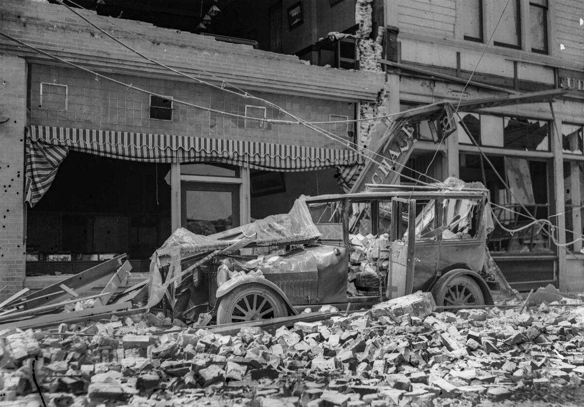 June 1925: Vehicle in Santa Barbara damaged by the June 29, 1925, earthquake. The small black dots on left of image were caused by air bubbles not disloged properly during processing of the original 4-by-5-inch glass negative.