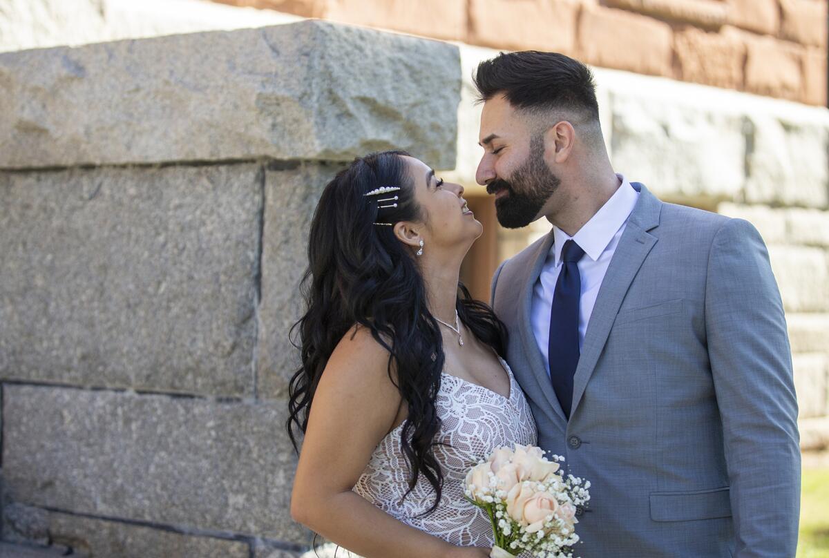 Diego Gonzalez and Gabriela Gutierrez kiss following their wedding ceremony.