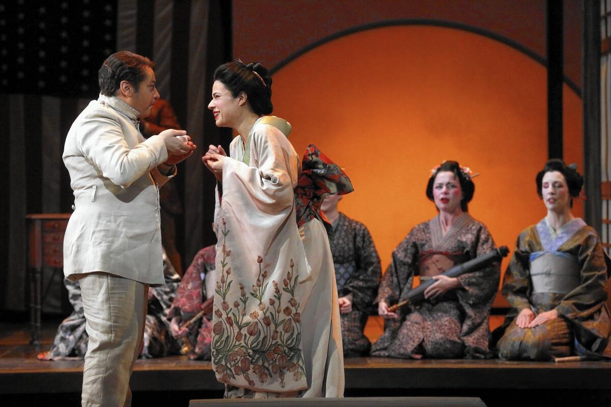 Stefano Secco, left, plays the American naval officer Benjamin Franklin Pinkerton and Ana Maria Martinez stars as the title character in L.A. Opera's production of "Madame Butterfly" at Dorothy Chandler Pavilion.