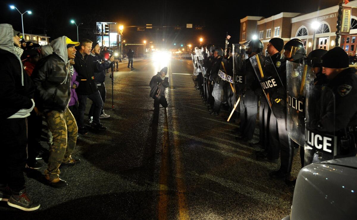 Protesters square off with police officers during a 2014 demonstration in Ferguson, Mo. The video app Vine played an important role in documenting the unrest.
