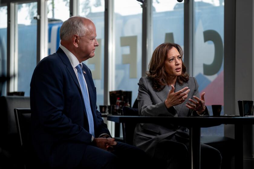 Minnesota Gov. Tim Walz and Vice President Kamala Harris are interviewed by CNN's Dana Bash at Kim's Cafe in Savannah, Georgia, on August 29, 2024. This is the first time Harris has sat with a journalist for an in-depth, on-the-record conversation since President Joe Biden ended his presidential bid in July. (Will Lanzoni/CNN)