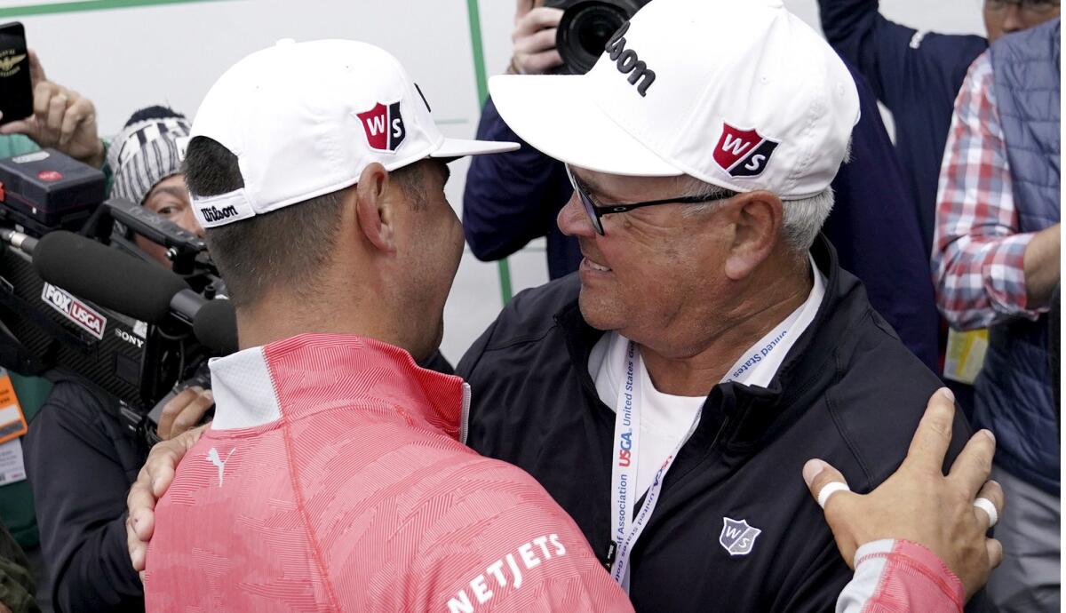 Gary Woodland celebrates with his father, Dan, after winning the U.S. Open on Sunday at Pebble Beach.