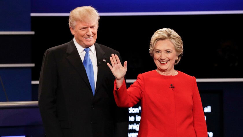 Donald Trump and Hillary Clinton pose for photos before their first presidential debate at Hofstra University in Hempstead, N.Y. on Sept. 26.