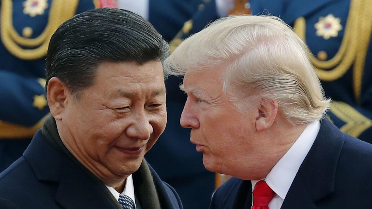 President Trump chats with Chinese President Xi Jinping at the Great Hall of the People in Beijing in 2017. They will both be at the G-20 leaders’ summit in Japan later this month, which could provide an opportunity for trade talks to restart.
