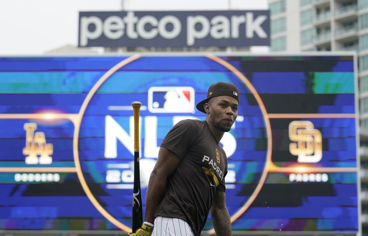 San Diego Padres right fielder Jose Azocar warms up during a team workout at Petco Park on Thursday.